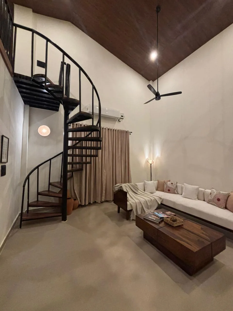 The living room and staircase at Semal